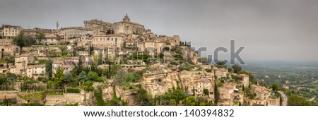 Panorama view of ancient French mountain village of Gordes in southern France. This is a HDR image. This historic town dates back to the 11th century. / Ancient French Hillside Village.