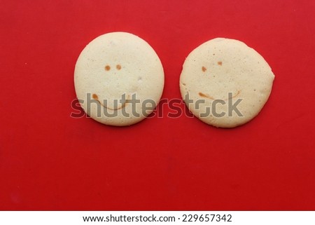 many face on cookies are on red background