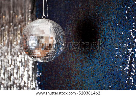 Mirror disco ball hanging from the ceiling.