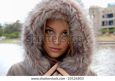 Beautiful girl in a fur jacket