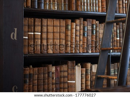 Dublin, Ireland - January 03, 2014: Shelves In The Long Room In Trinity College Library. Measured At Almost 65 Metres (213 Ft) Long And It Is The Permanent Home To The Famous Book Of Kells.