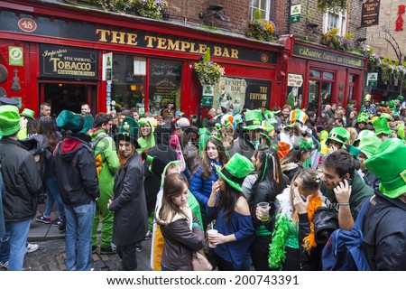 DUBLIN, IRELAND - MARCH 17: Saint Patrick\'s Day parade in Dublin Ireland on March 17, 2014: People dress up Saint Patrick\'s at The Temple Bar