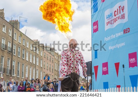 Dublin, Ireland - July 13: Fire-eater spiting fire in The Laya Healthcate City Spectacular Festival at Merrion Square Garden in Dublin, Ireland on July 13, 2014