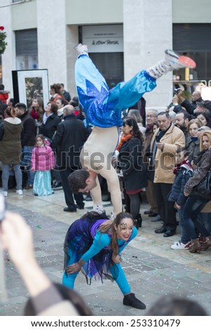 Malaga, Spain - Feb 08, 2015: Acrobatic couple in performance in the carnival parade in Malaga, Spain on February 08, 2015