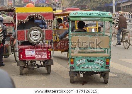DELHI - FEB 8 - The auto-rickshaw or \'tuk-tuk\' is the most used means of transport in big cities of India. At any time of day thousands of such vehicles flood the city streets. February 8, 2014 in Delhi.