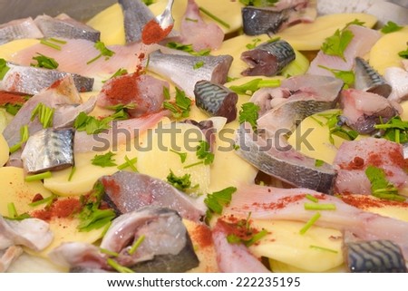 Preparing fish stew in casserole.