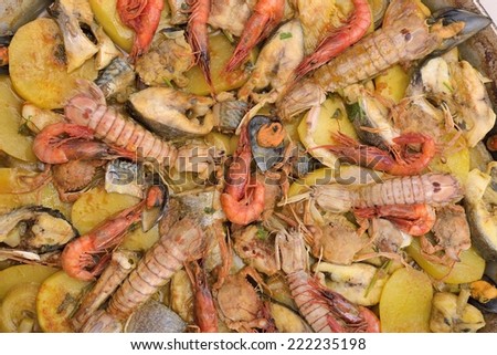 A stew of assorted fish and seafood in casserole.