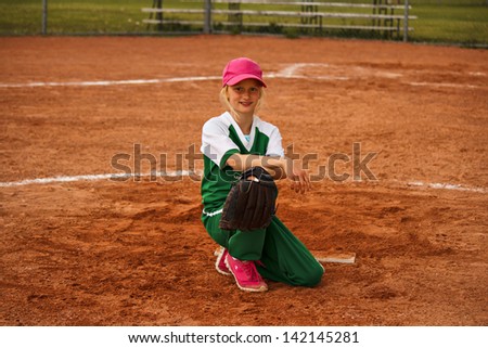 Child posing in a baseball uniform