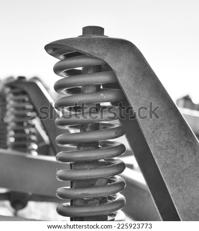 Coiled spring on industrial equipment