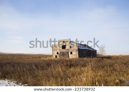 Abandoned old shop in rural landscape