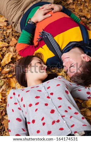 Portrait of couple enjoying golden autumn fall season