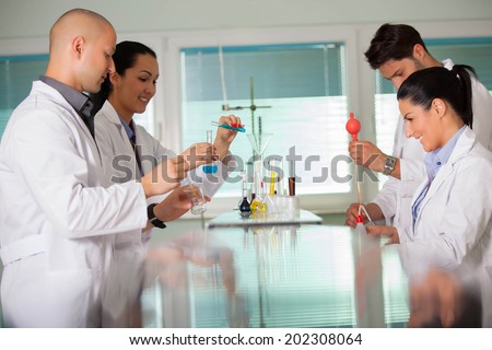 Young scientist works in modern chemistry lab