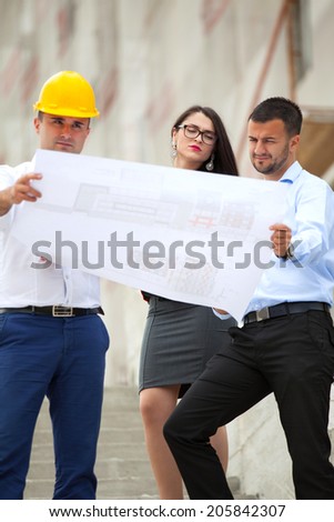 Team of architects working on construction plans