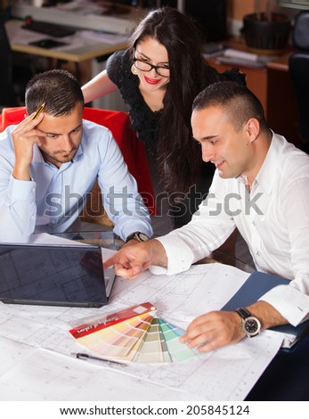 Team of architects working on construction plans