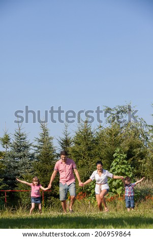 Happy Family In Garden
