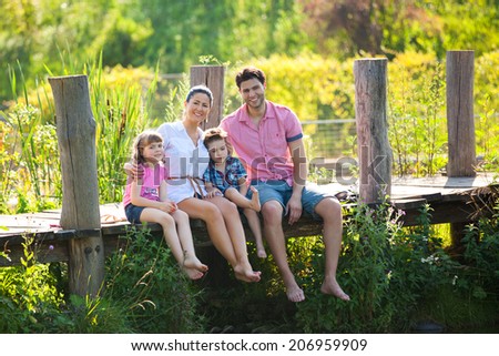 Happy Family In Garden