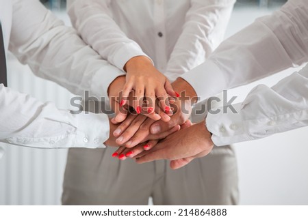 Team work concept. Business people joining hands.