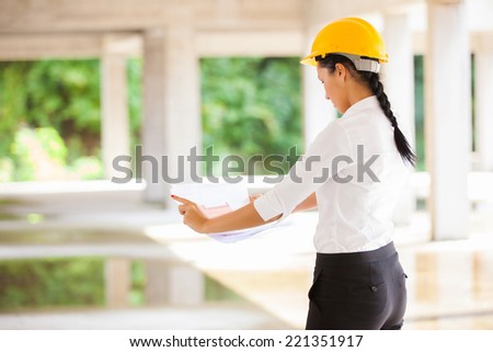 architect female engineer against building yard