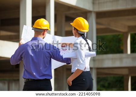 Construction manager and engineer woman working on building site