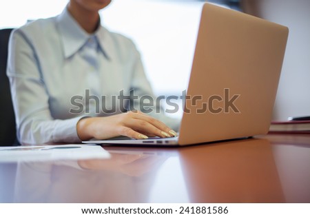 people hands typing on laptop keyboard