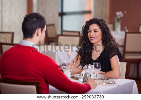 couple sitting at the table in restaurant