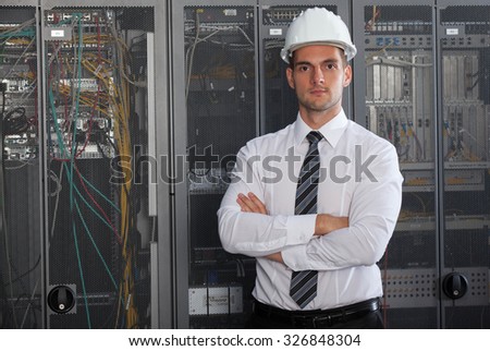 network engineer working in server room