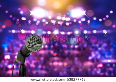 Close up microphone  on stage in concert hall or conference ball room.