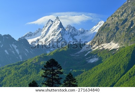 This is snow summits in Caucasus mountains in summer