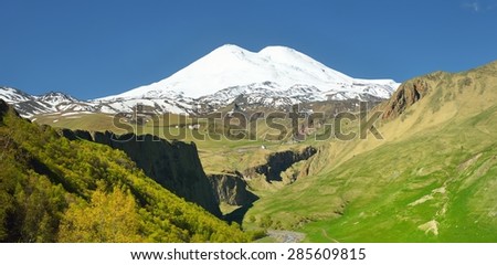 This is sunny landscape in Caucasus mountains,valley about Elbrus