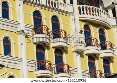 A lot of the balconies of the yellow house