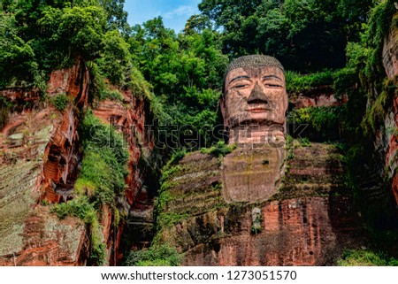 Dark Colorful View of Leshan Giant Buddha in Sichuan Province, China. Ancient Stone Sculpture Carving in Cliff Face.