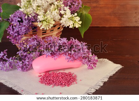 Bouquet of lilac, fragrant soaps and bath balls