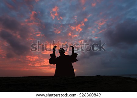 Muslim men silhouette blurred background,Silhouettes Muslim prayer,the light of faith, hope, faith, supplication,Hand of Muslim people praying with mosque interior background,