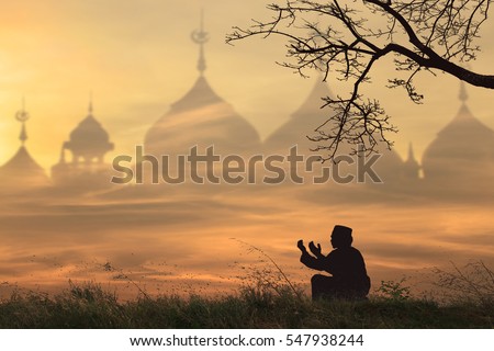 Silhouettes Muslim prayer,the light of faith, hope, faith, supplication,Concept of Islam is the religion, Young Muslim man praying mosque blurred background