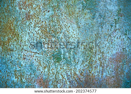 old metal corrosion blue background with yellow and red spots.