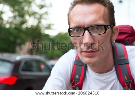 close up portrait man in city traffic