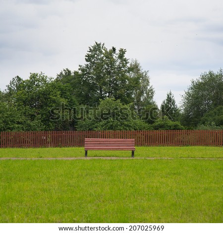 lonely bench on the park loan in rainy day