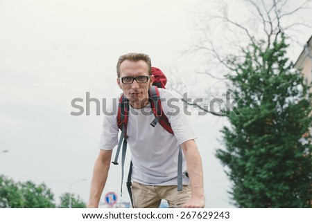 man on bike look directly into the camera