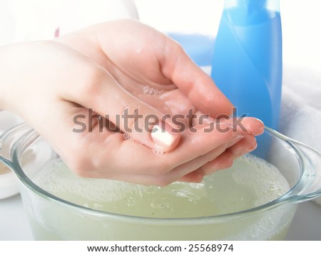 Foam of soap and female hands