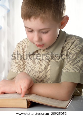 The boy with books on the white background