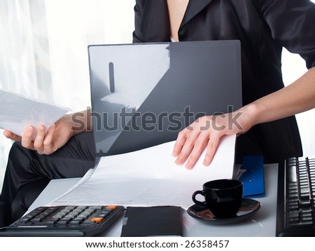The beautiful girl behind a desktop