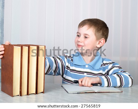The child with books on the table