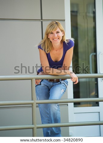 The happy student at doors of an input in an educational institution