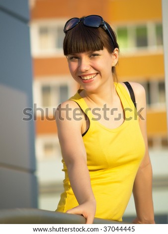 The happy student at doors of an input in an educational institution