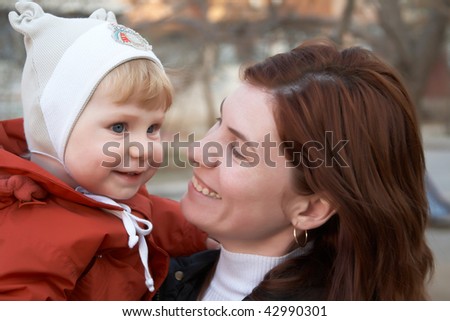 The little boy with mum on walk in the spring