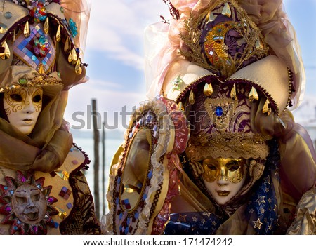 VENICE, ITALY - FEBRUARY 03, 2013 : Unidentified women with Venetian Carnival mask in Venice, Italy on February 03. 2013.  In 2013 the Venetian Carnival was held between 01 and 12 of February.