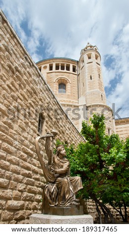 JERUSALEM, ISRAEL - APRIL 21,2014:King David plying harp  statue near Mount Zion in Old City of Jerusalem, Israel on April 21,2014. This new statue was presented by Moscow Christians some years ago.