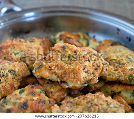 Chicken french cutlets on steel pan.