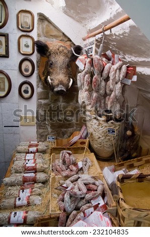 GREVE IN CHIANTI - OCTOBER 12, 2014 : Tuscan sausage and ham on display of market in Greve in Chianti, Tuscany-Italy.