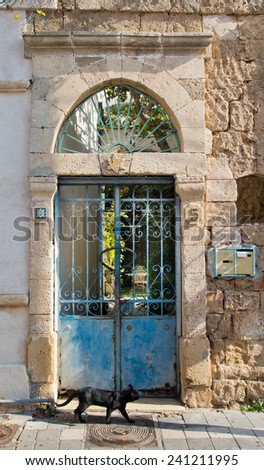 Vintage iron gates at stone villa in old town of Tel Aviv.
